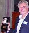 Managing director Gianni Comoretto receives an award in recognition of his 25 years service to the company